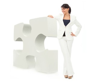 Business woman with a puzzle